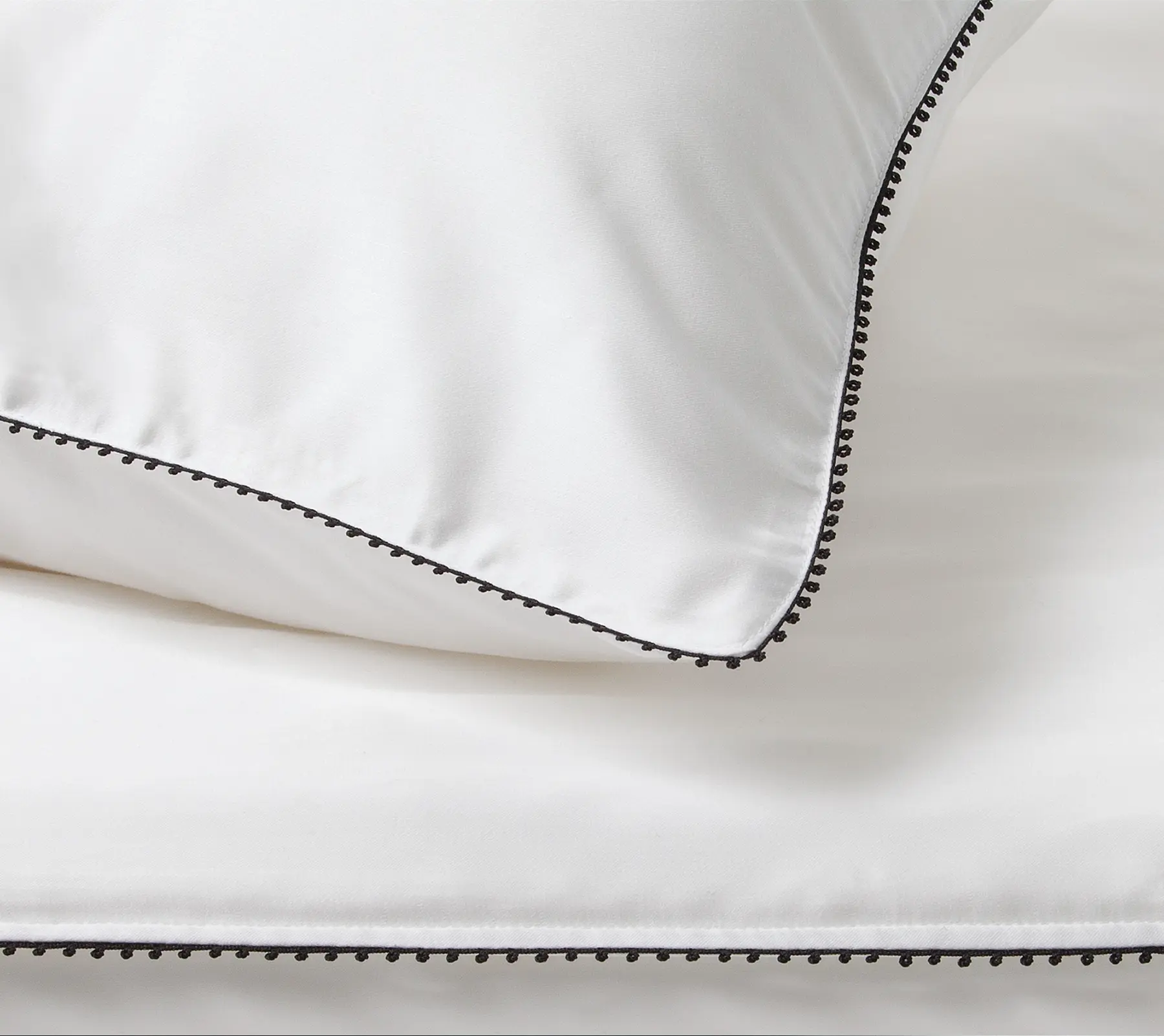 Detail of Beltrami pillowcase with black patterned border