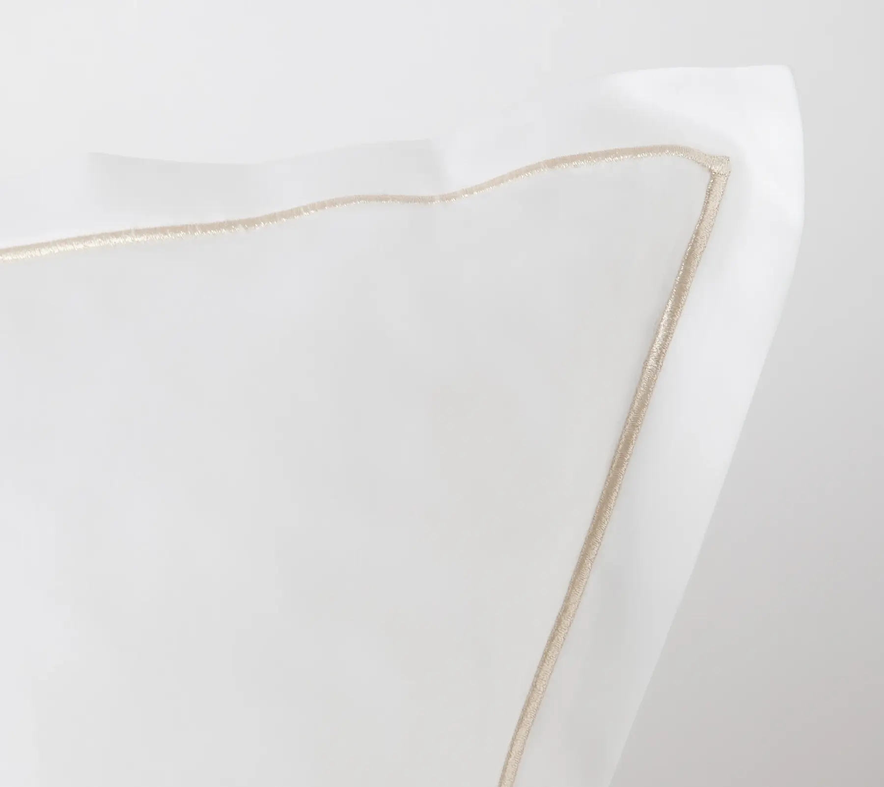 Detail of Beltrami bed sheets with gold trim