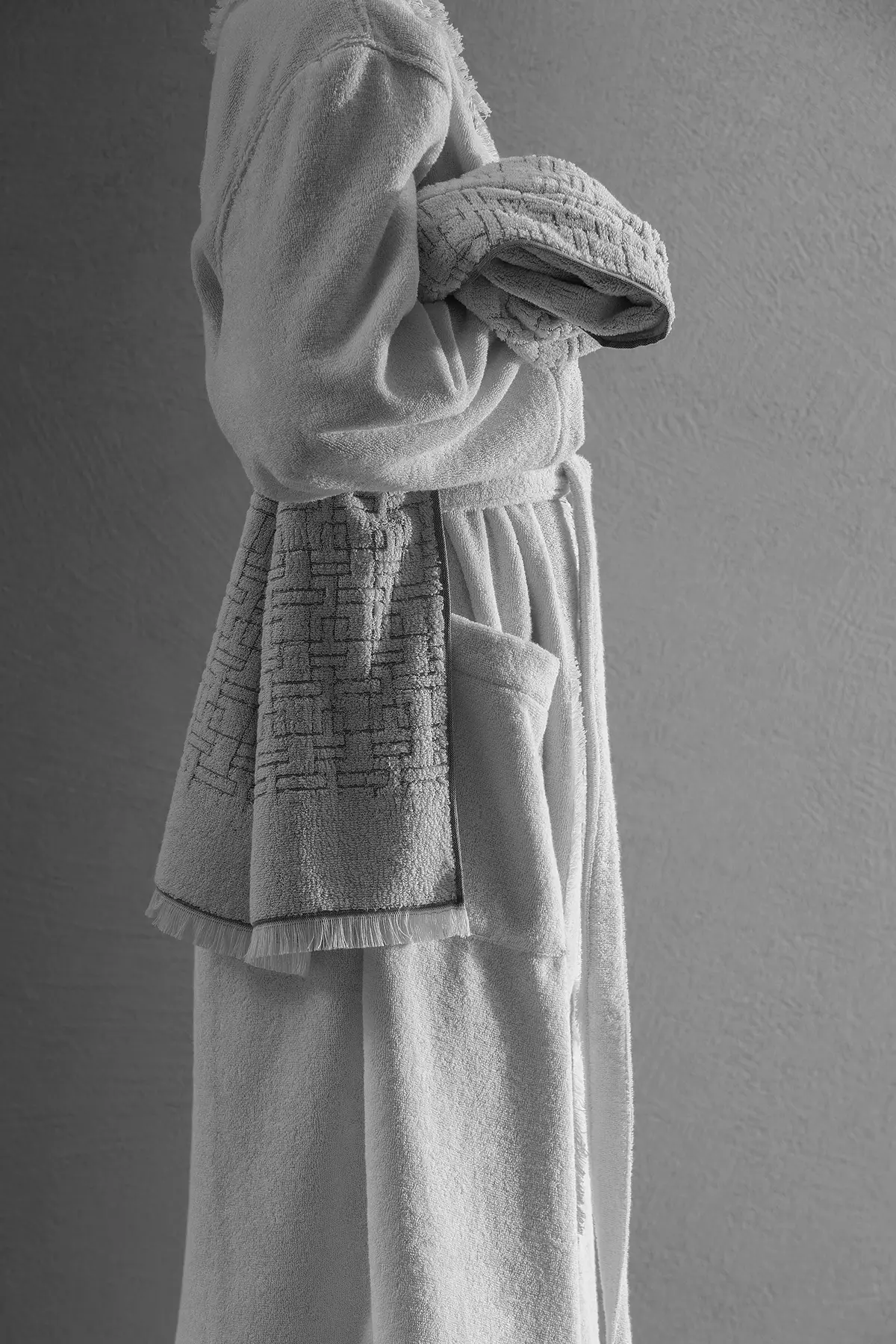 Close-up of a white Beltrami bathrobe being worn