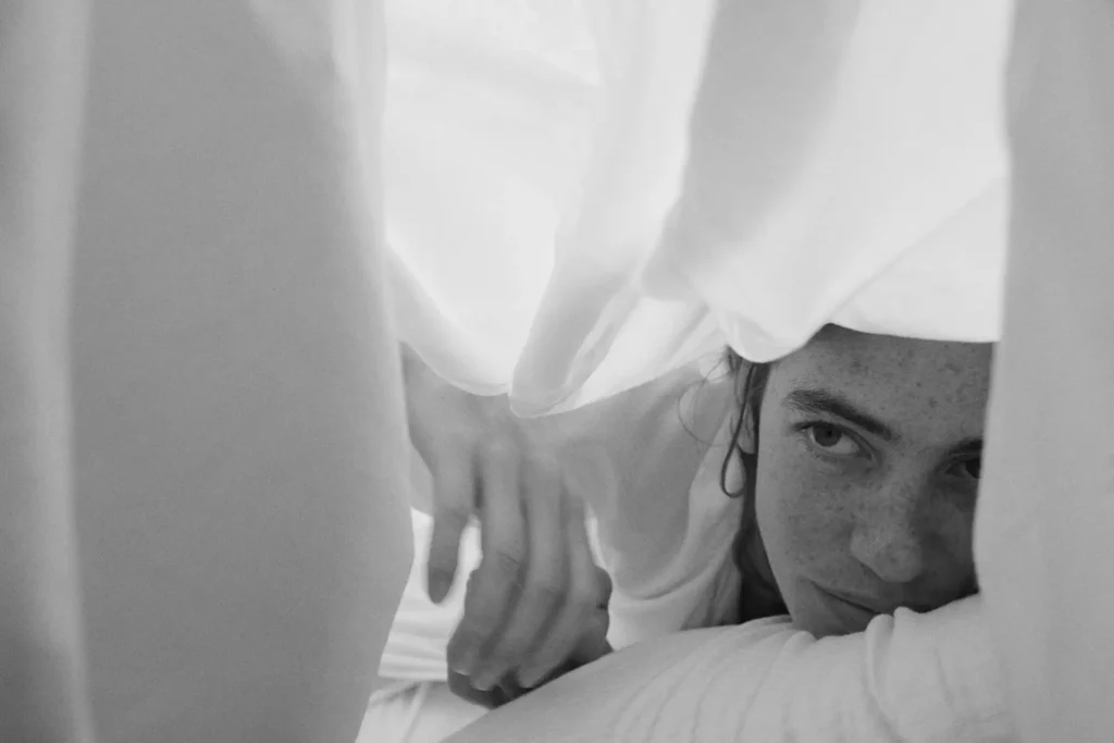 Girl gazing from amidst Beltrami sheets
